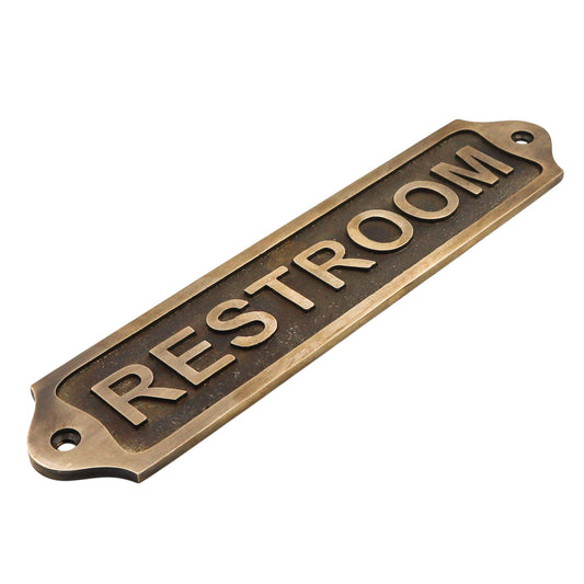 Bronze 'RESTROOM' sign on a white background